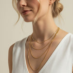 mariner chain necklace on-model, anchor link necklace gold, 18K gold overlay chain, nautical chain necklace, layered mariner chain, statement link necklace, textured gold chain, mariner necklace close-up