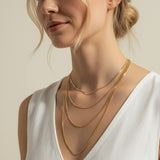 mariner chain necklace on-model, anchor link necklace gold, 18K gold overlay chain, nautical chain necklace, layered mariner chain, statement link necklace, textured gold chain, mariner necklace close-up