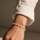 pearl station bracelet, wire wrapped pearl bracelet, oval pearl bracelet, gold and pearl bracelet, dainty pearl bracelet, adjustable pearl bracelet, rice pearl bracelet, lobster clasp pearl bracelet, bridal pearl bracelet, everyday pearl bracelet, layering bracelet, women’s pearl bracelet