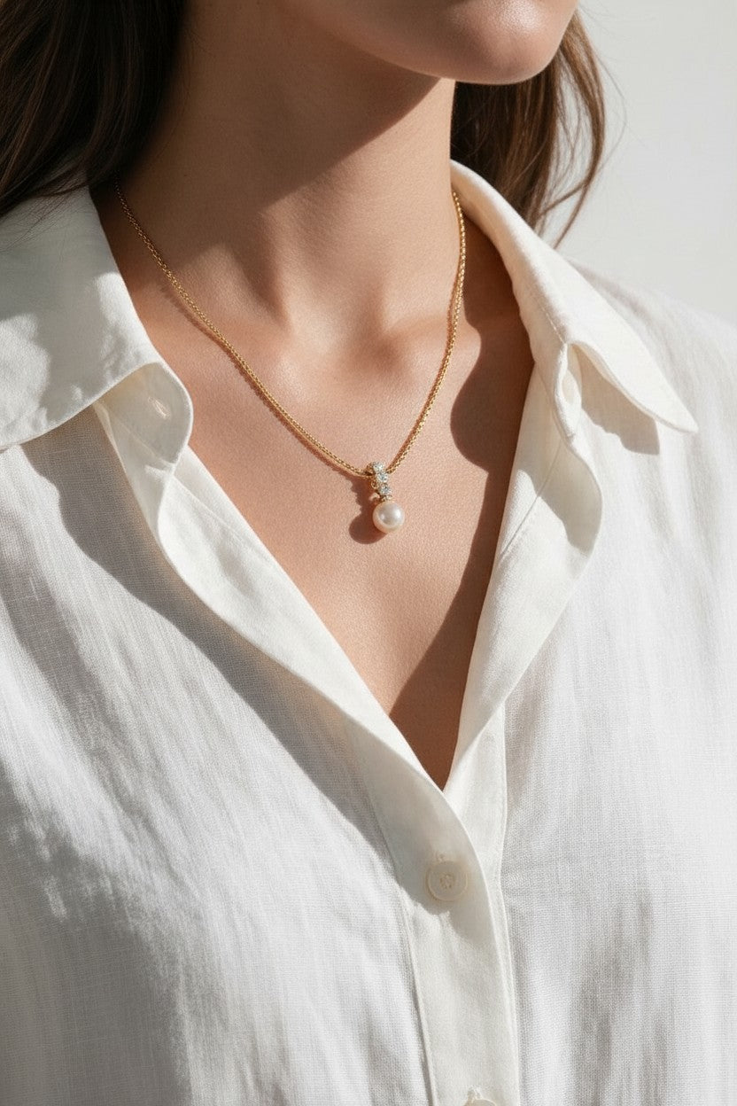 pearl necklace and earring set, pearl drop pendant necklace, pearl drop earrings, bridal pearl jewelry set, gold pearl pendant on model, classic pearl jewelry, pearl and crystal earrings, matching necklace and earring set, wedding jewelry set, elegant pearl jewelry, gift jewelry set for her, women’s pearl jewelry set