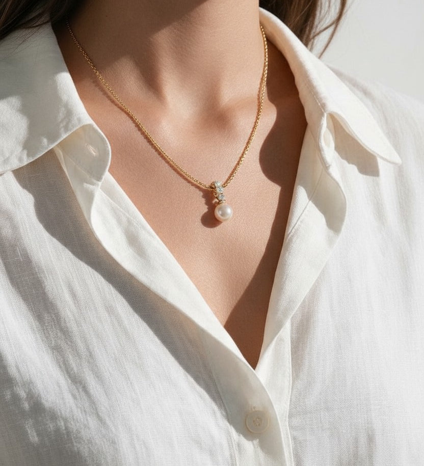 pearl necklace and earring set, pearl drop pendant necklace, pearl drop earrings, bridal pearl jewelry set, gold pearl pendant on model, classic pearl jewelry, pearl and crystal earrings, matching necklace and earring set, wedding jewelry set, elegant pearl jewelry, gift jewelry set for her, women’s pearl jewelry set