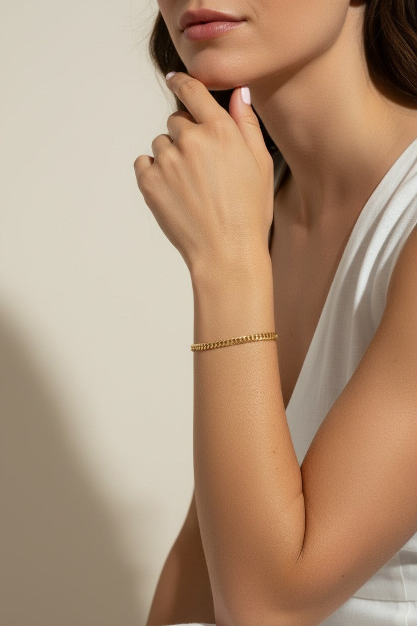 gold curb chain bracelet, curb link bracelet, chunky gold bracelet, everyday gold bracelet, flat link bracelet, statement chain bracelet, classic gold jewelry, on-model bracelet photography