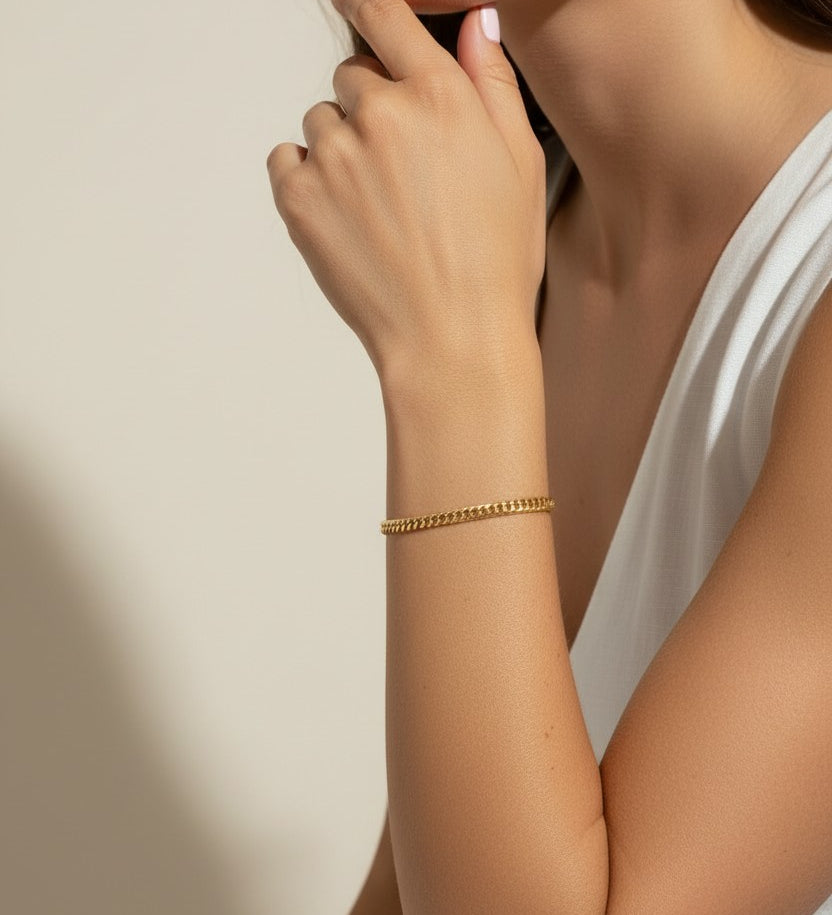 gold curb chain bracelet, curb link bracelet, chunky gold bracelet, everyday gold bracelet, flat link bracelet, statement chain bracelet, classic gold jewelry, on-model bracelet photography
