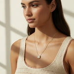 gold paperclip chain necklace, square halo pendant necklace, crystal pendant necklace on model, princess cut pendant necklace, pavé halo necklace, dainty gold necklace, gold-tone layering necklace, collarbone necklace, everyday gold necklace, minimalist pendant necklace, gift for her jewelry, scoop neck necklace