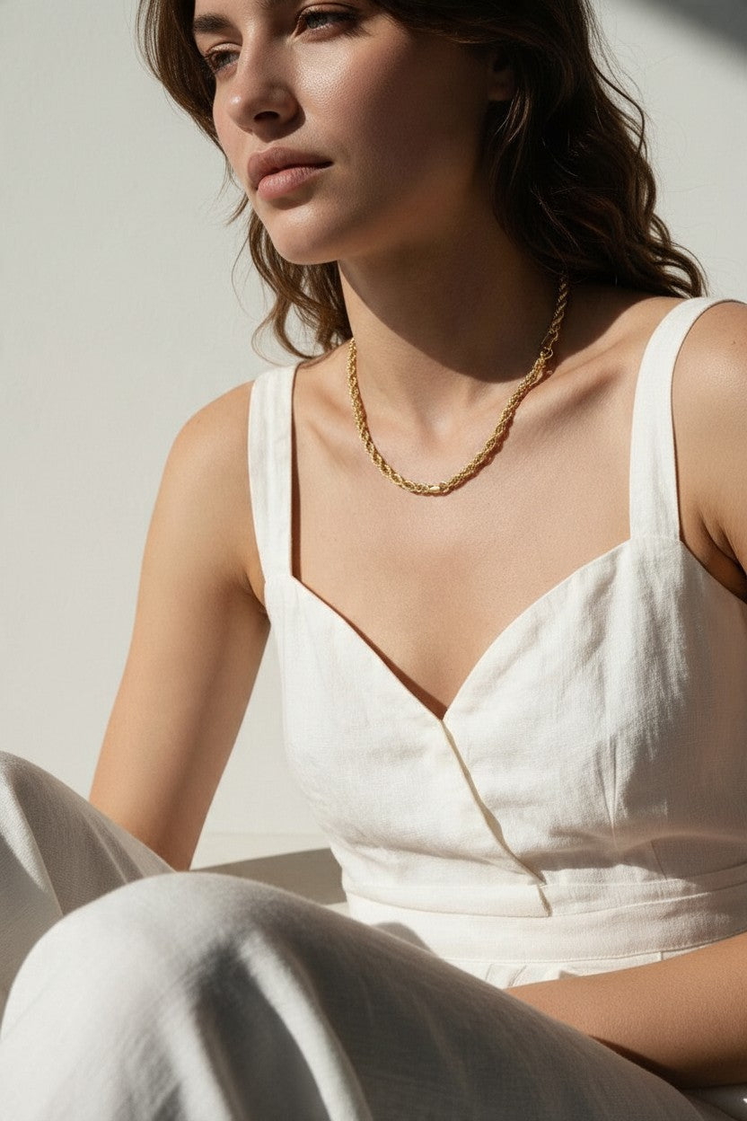 gold rope chain on model, twisted rope chain necklace, classic gold chain necklace, collarbone length chain, everyday gold necklace, layering chain necklace, unisex gold chain, medium rope chain, gold chain with lobster clasp, timeless gold jewelry, women’s gold rope chain, minimalist gold necklace