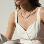 gold rope chain on model, twisted rope chain necklace, classic gold chain necklace, collarbone length chain, everyday gold necklace, layering chain necklace, unisex gold chain, medium rope chain, gold chain with lobster clasp, timeless gold jewelry, women’s gold rope chain, minimalist gold necklace