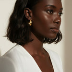 hammered gold hoop earrings, textured hoop earrings, gold huggie hoops, everyday gold earrings, small gold hoops, organic texture earrings, minimalist gold jewelry, on-model earring photography