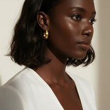 hammered gold hoop earrings, textured hoop earrings, gold huggie hoops, everyday gold earrings, small gold hoops, organic texture earrings, minimalist gold jewelry, on-model earring photography