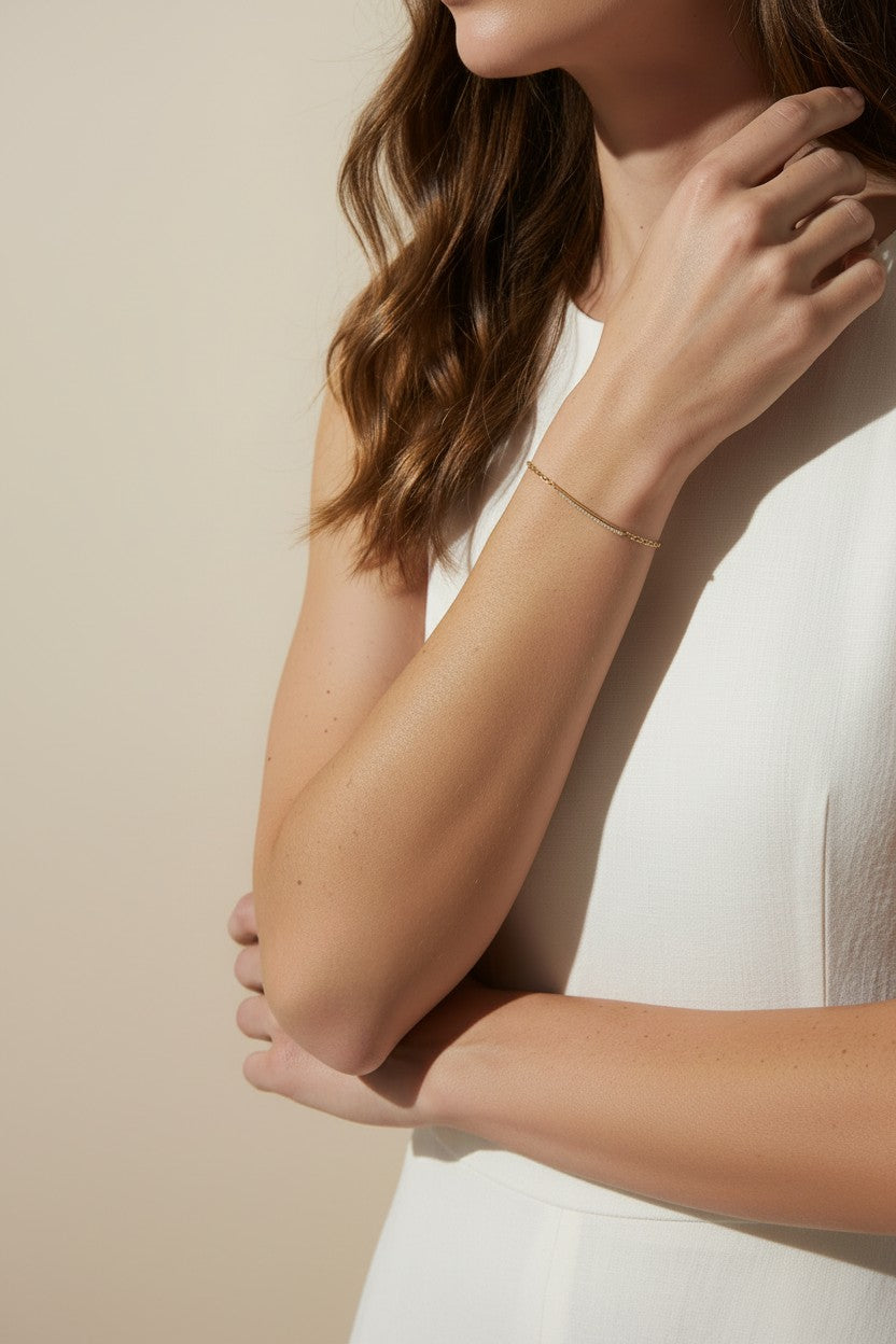 CZ bar bracelet on model, cubic zirconia bracelet wrist shot, gold bracelet close-up, sparkly bar bracelet on model, dainty CZ bracelet, layering bracelet lifestyle, gold overlay bracelet on wrist, minimalist CZ jewelry