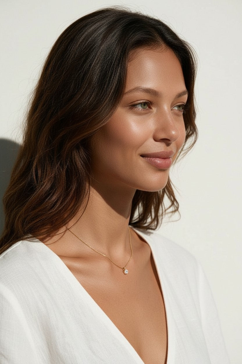 gold solitaire necklace on model, dainty solitaire pendant, minimalist gold necklace, single stone pendant necklace, delicate gold chain necklace, cubic zirconia solitaire necklace, collarbone necklace, everyday sparkle necklace, layering necklace, anniversary gift for her, bridesmaid necklace, gift for her