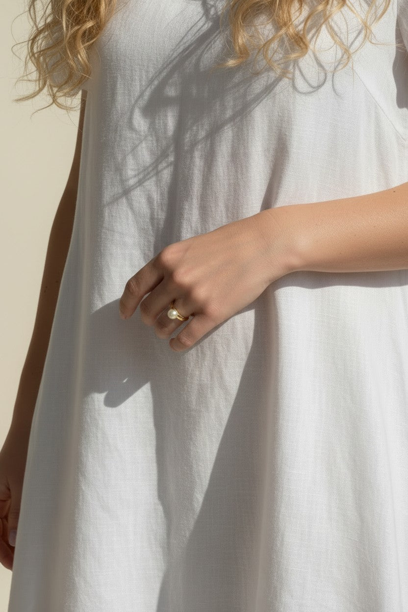 gold pearl ring worn, pearl ring on hand fit, gold filled ring lifestyle photo, minimalist pearl ring styled, freshwater pearl ring close-up, domed pearl ring on finger