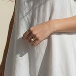 gold pearl ring worn, pearl ring on hand fit, gold filled ring lifestyle photo, minimalist pearl ring styled, freshwater pearl ring close-up, domed pearl ring on finger