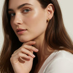 chunky gold hoop earrings, dome hoop earrings on model, puffy gold earrings, statement gold earrings, sculptural gold hoops, minimalist chunky earrings, high shine gold earrings, gold earrings close-up