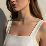 CZ tennis choker on model, baguette round cut necklace, sparkly choker close-up, stainless steel tennis necklace, cubic zirconia choker on model, statement choker necklace, layering CZ necklace, glamorous choker photo