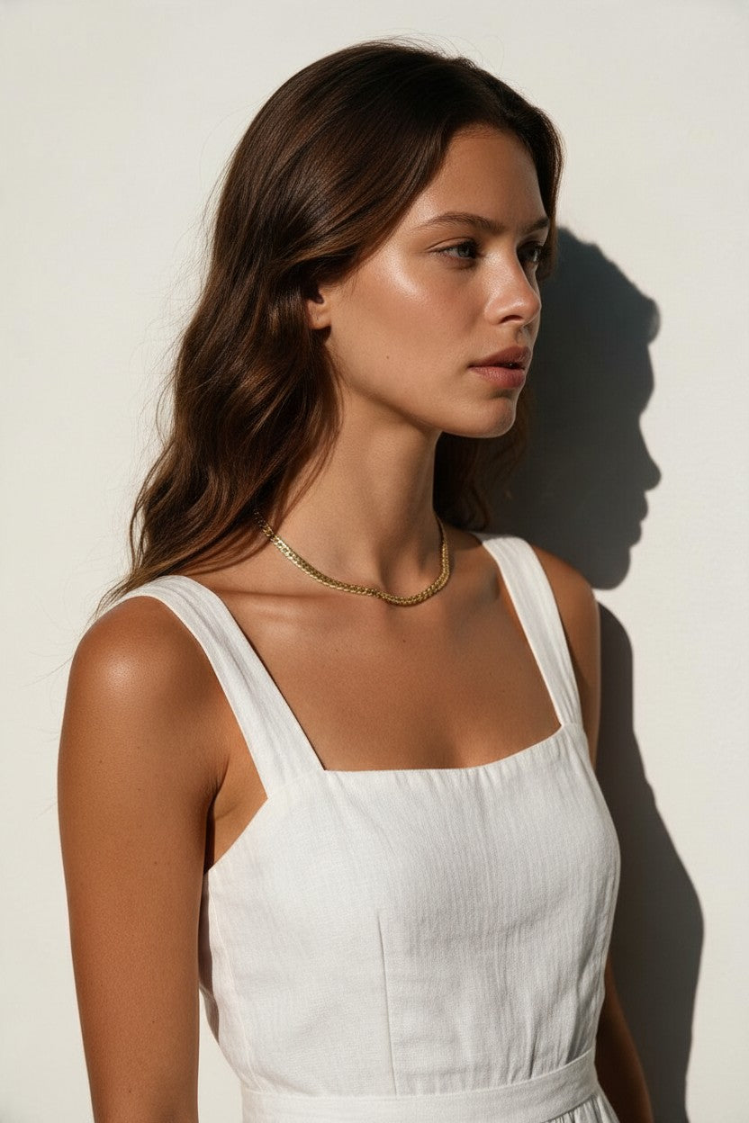 gold herringbone necklace on model, flat gold chain necklace, shiny herringbone chain, collarbone length necklace, minimalist gold necklace, everyday gold chain, layering chain necklace, flat snake chain, adjustable gold necklace, sleek gold jewelry, women’s gold chain necklace, summer gold necklace