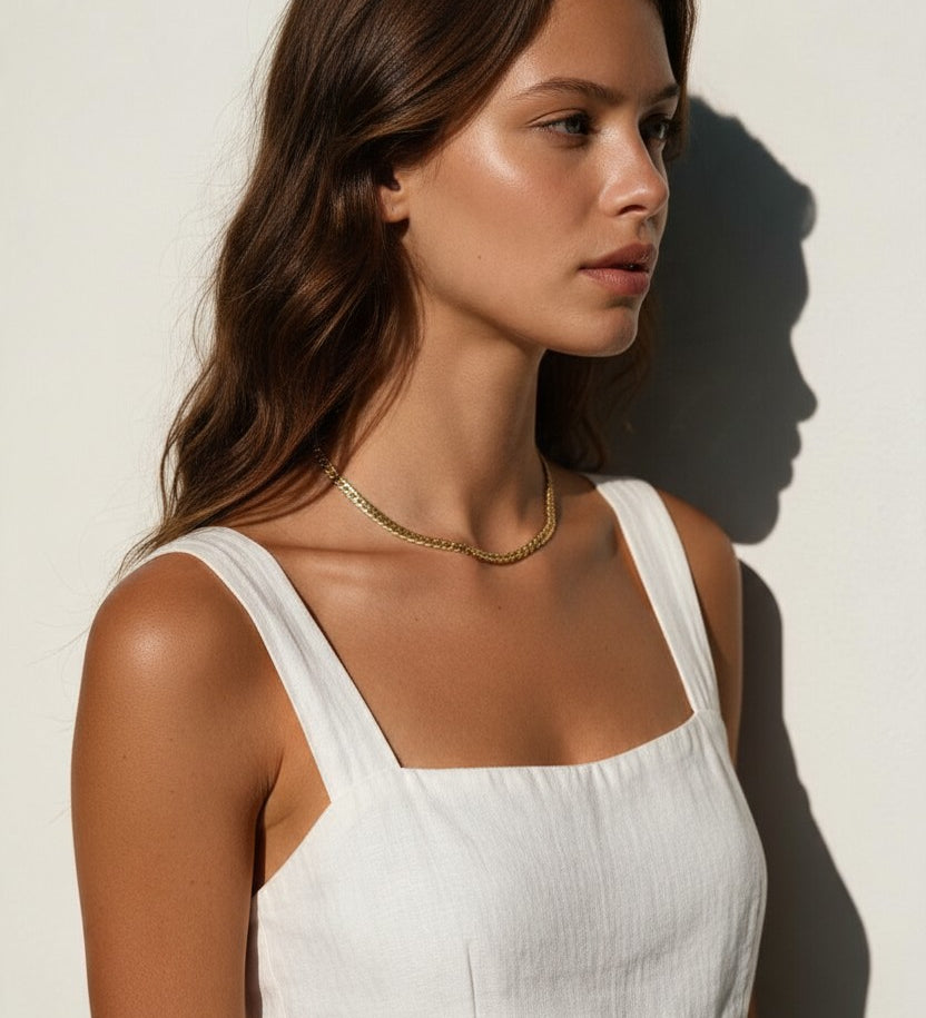 gold herringbone necklace on model, flat gold chain necklace, shiny herringbone chain, collarbone length necklace, minimalist gold necklace, everyday gold chain, layering chain necklace, flat snake chain, adjustable gold necklace, sleek gold jewelry, women’s gold chain necklace, summer gold necklace