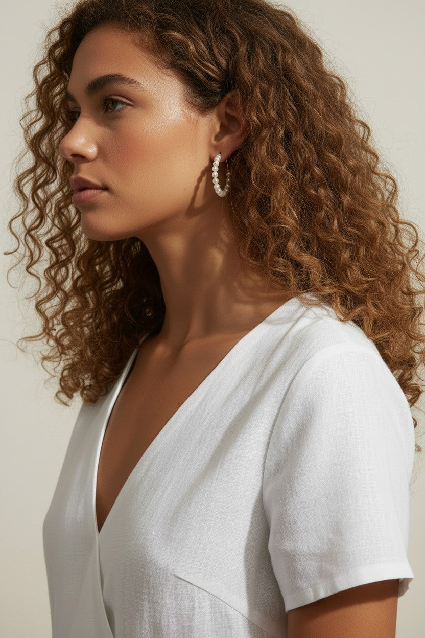 pearl hoop earrings worn, pearl earrings on model multiple hairstyles, classic pearl hoops lifestyle photo, wedding pearl earrings styled, freshwater pearl hoops fit, timeless pearl earrings close-up
