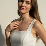 CZ tennis choker on model, baguette round cut necklace, sparkly choker close-up, stainless steel tennis necklace, cubic zirconia choker on model, statement choker necklace, layering CZ necklace, glamorous choker photo