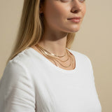 herringbone chain layering, mixed width gold necklaces, layered herringbone necklace set, gold chain stacking, 18k gold overlay layered necklaces, herringbone necklace styling, thick and thin chain layering, gold necklace stack on model