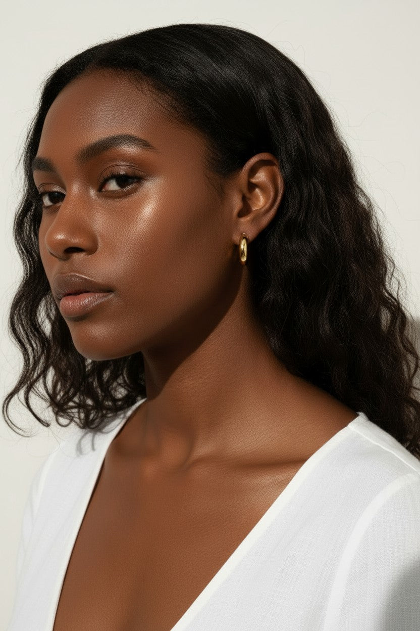 chunky round hoop earrings, gold tube hoop earrings, bold gold hoops on model, small chunky hoops, polished round hoops, statement gold hoops, everyday hoop earrings, thick gold hoop earrings