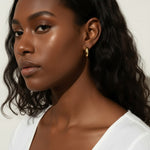 chunky round hoop earrings, gold tube hoop earrings, bold gold hoops on model, small chunky hoops, polished round hoops, statement gold hoops, everyday hoop earrings, thick gold hoop earrings