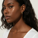 chunky round hoop earrings, gold tube hoop earrings, bold gold hoops on model, small chunky hoops, polished round hoops, statement gold hoops, everyday hoop earrings, thick gold hoop earrings