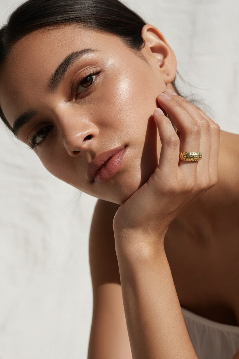 chunky gold dome ring on hand, crystal dome ring, wide gold band ring, statement gold ring, sparkly dome ring, cubic zirconia band ring, thick gold ring, scattered crystal ring, gold stacking ring, bold gold ring, matching ring and earrings, women’s chunky ring