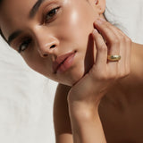 chunky gold dome ring on hand, crystal dome ring, wide gold band ring, statement gold ring, sparkly dome ring, cubic zirconia band ring, thick gold ring, scattered crystal ring, gold stacking ring, bold gold ring, matching ring and earrings, women’s chunky ring