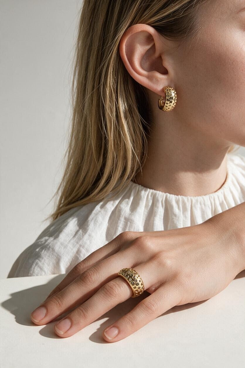 chunky gold hoop earrings on model, dome hoop earrings, crystal c hoop earrings, thick gold huggie earrings, sparkly gold hoops, statement huggie earrings, matching ring and earrings set, chunky gold dome ring, cubic zirconia hoop earrings, gold dome earrings, bold gold jewelry set, women’s chunky hoops