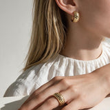 chunky gold hoop earrings on model, dome hoop earrings, crystal c hoop earrings, thick gold huggie earrings, sparkly gold hoops, statement huggie earrings, matching ring and earrings set, chunky gold dome ring, cubic zirconia hoop earrings, gold dome earrings, bold gold jewelry set, women’s chunky hoops