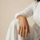 croissant ring on model, twisted ridge gold ring, textured dome ring lifestyle, chunky gold ring styled, 18k gold overlay ring, statement gold ring on hand, ribbed gold band ring, sculptural gold ring outfit