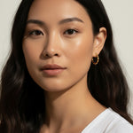 twisted rope hoop earrings, gold twist hoops on-model, 18K gold overlay hoops, small textured hoops, everyday gold hoops, rope texture earrings, dainty hoop earrings, twist hoop jewelry