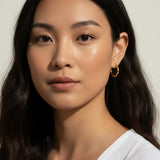 twisted rope hoop earrings, gold twist hoops on-model, 18K gold overlay hoops, small textured hoops, everyday gold hoops, rope texture earrings, dainty hoop earrings, twist hoop jewelry