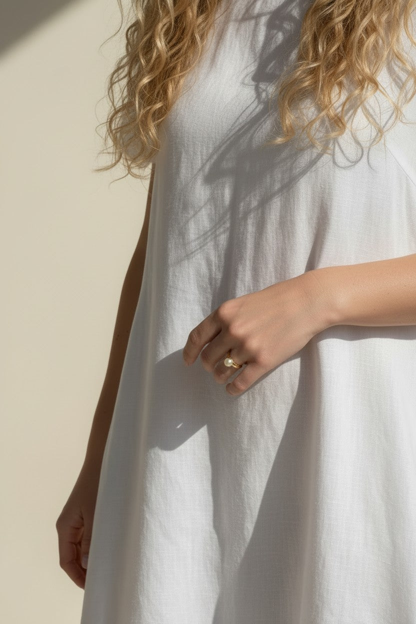 gold pearl ring worn, pearl ring on hand fit, gold filled ring lifestyle photo, minimalist pearl ring styled, freshwater pearl ring close-up, domed pearl ring on finger