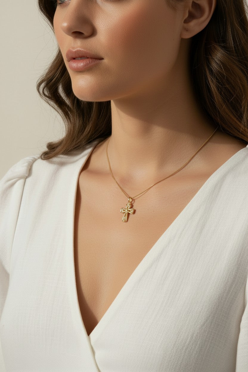 gold ornate cross necklace