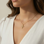 gold ornate cross necklace