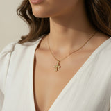 gold ornate cross necklace