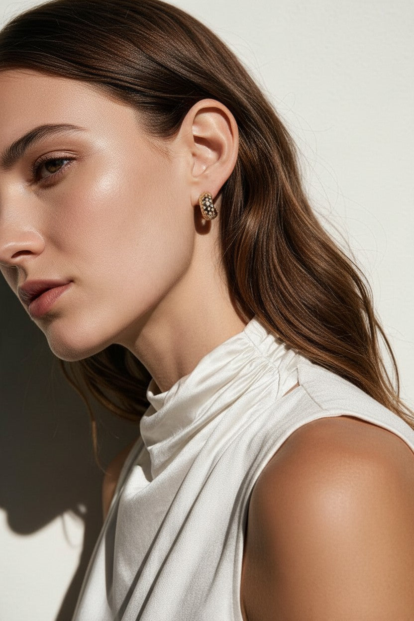 chunky gold hoop earrings on model, dome hoop earrings, crystal c hoop earrings, thick gold huggie earrings, sparkly gold hoops, statement huggie earrings, matching ring and earrings set, chunky gold dome ring, cubic zirconia hoop earrings, gold dome earrings, bold gold jewelry set, women’s chunky hoops