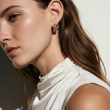 chunky gold hoop earrings on model, dome hoop earrings, crystal c hoop earrings, thick gold huggie earrings, sparkly gold hoops, statement huggie earrings, matching ring and earrings set, chunky gold dome ring, cubic zirconia hoop earrings, gold dome earrings, bold gold jewelry set, women’s chunky hoops