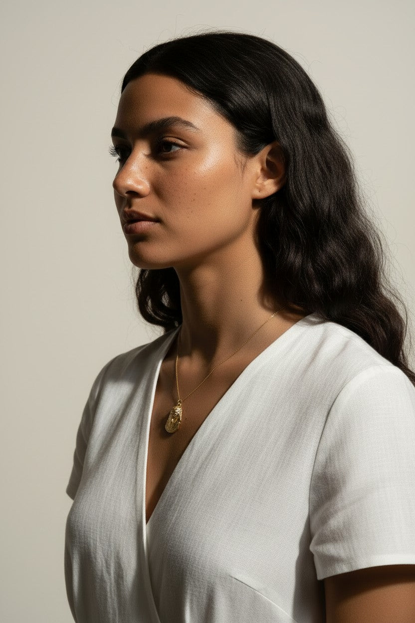 gold pharaoh necklace, Egyptian mask pendant necklace, King Tut necklace, statement gold necklace, Egyptian jewelry, textured gold necklace, historical pendant necklace, on-model necklace photography