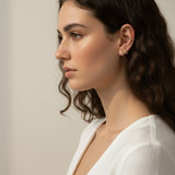 gold beaded huggie hoops, small gold hoop earrings, stacked ear look, beaded hoop earrings, layered earring set, gold huggie hoops on model, dainty gold hoops, curated ear stack