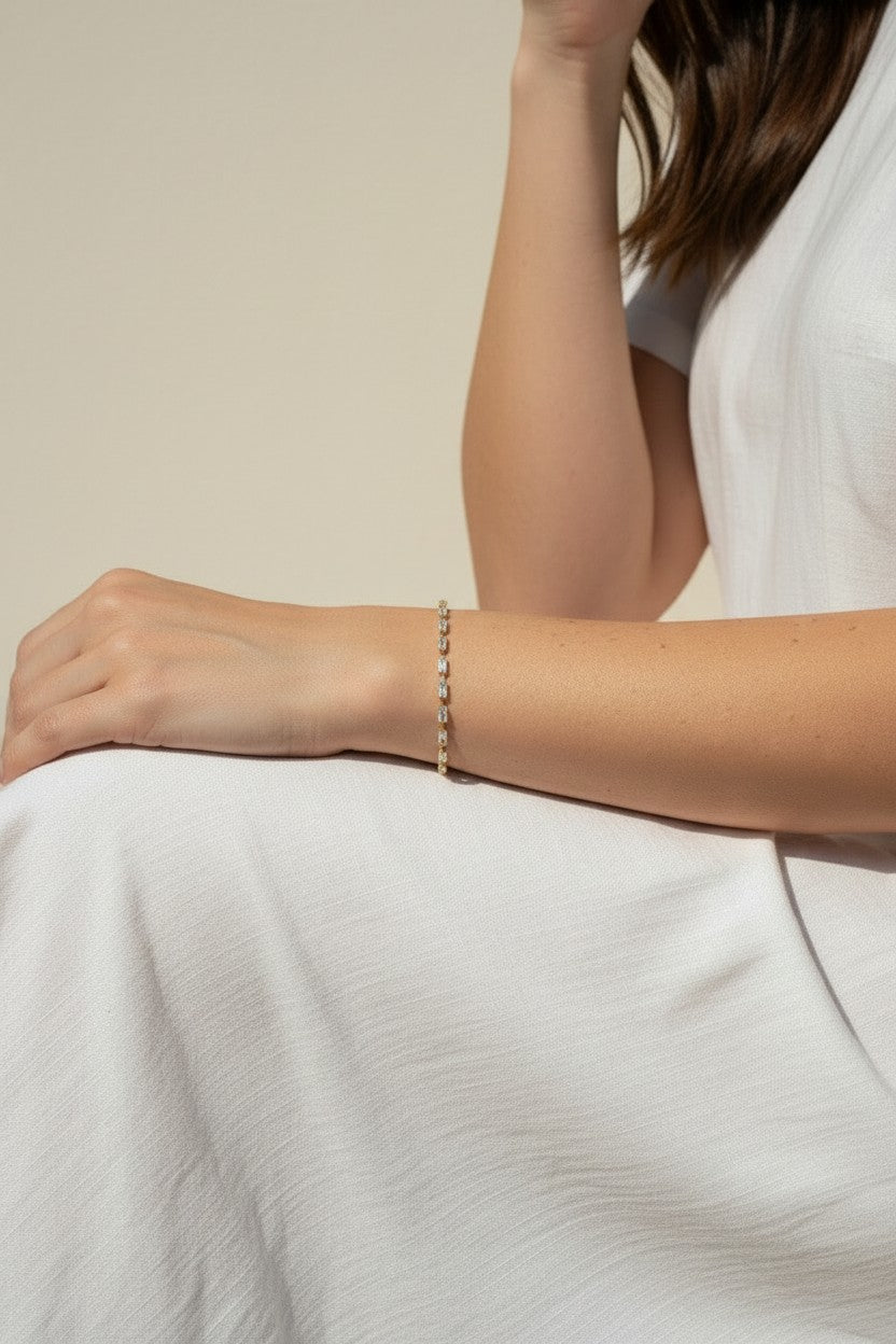 CZ tennis bracelet on model, baguette round cut bracelet wrist shot, cubic zirconia bracelet lifestyle, sparkly tennis bracelet on wrist, gold CZ bracelet on model, matching tennis jewelry, dainty tennis bracelet, statement CZ bracelet photo