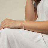 CZ tennis bracelet on model, baguette round cut bracelet wrist shot, cubic zirconia bracelet lifestyle, sparkly tennis bracelet on wrist, gold CZ bracelet on model, matching tennis jewelry, dainty tennis bracelet, statement CZ bracelet photo