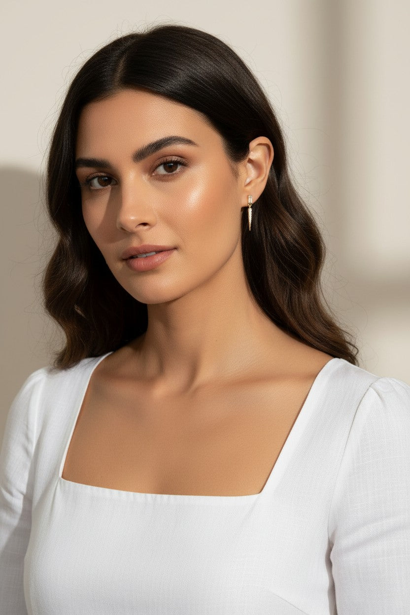 baguette crystal earrings, crystal drop earrings, pave drop earrings gold, dainty crystal earrings, statement drop earrings, sparkly stud and drop earrings, 18K gold overlay earrings, crystal earrings on-model