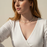 baroque pearl necklace, front toggle clasp necklace, freshwater pearl chain necklace, gold and pearl necklace on model, organic pearl necklace, statement clasp pearl necklace, dainty pearl choker, pearl necklace close-up