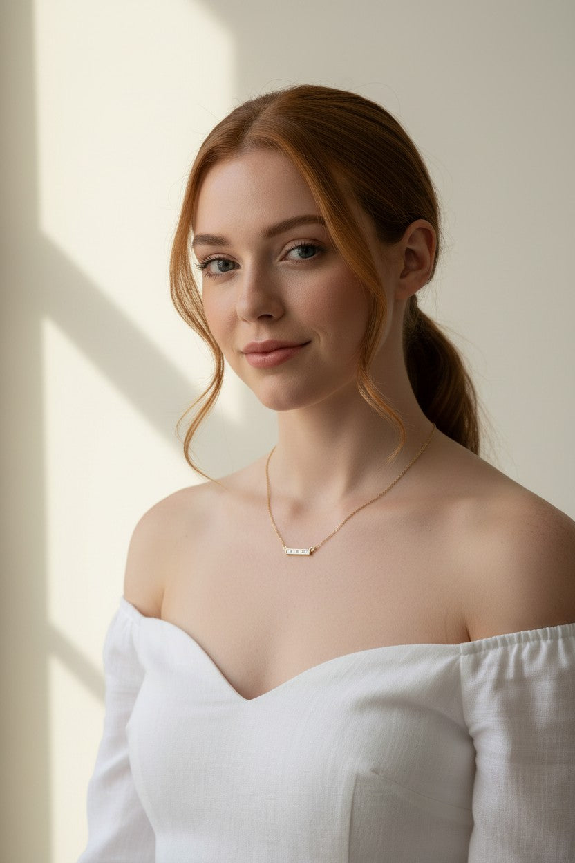 baguette bar necklace on model, clear baguette pendant necklace, gold bar necklace with stones, delicate layering necklace, minimalist sparkle necklace, baguette pendant on collarbone, gold chain bar necklace, dainty statement necklace