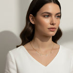 love necklace on model, letter charm necklace lifestyle, dangling love pendant styled, pavé letter necklace worn, gold love charm necklace, sentimental jewelry gift, word necklace on neck, cubic zirconia letter necklace
