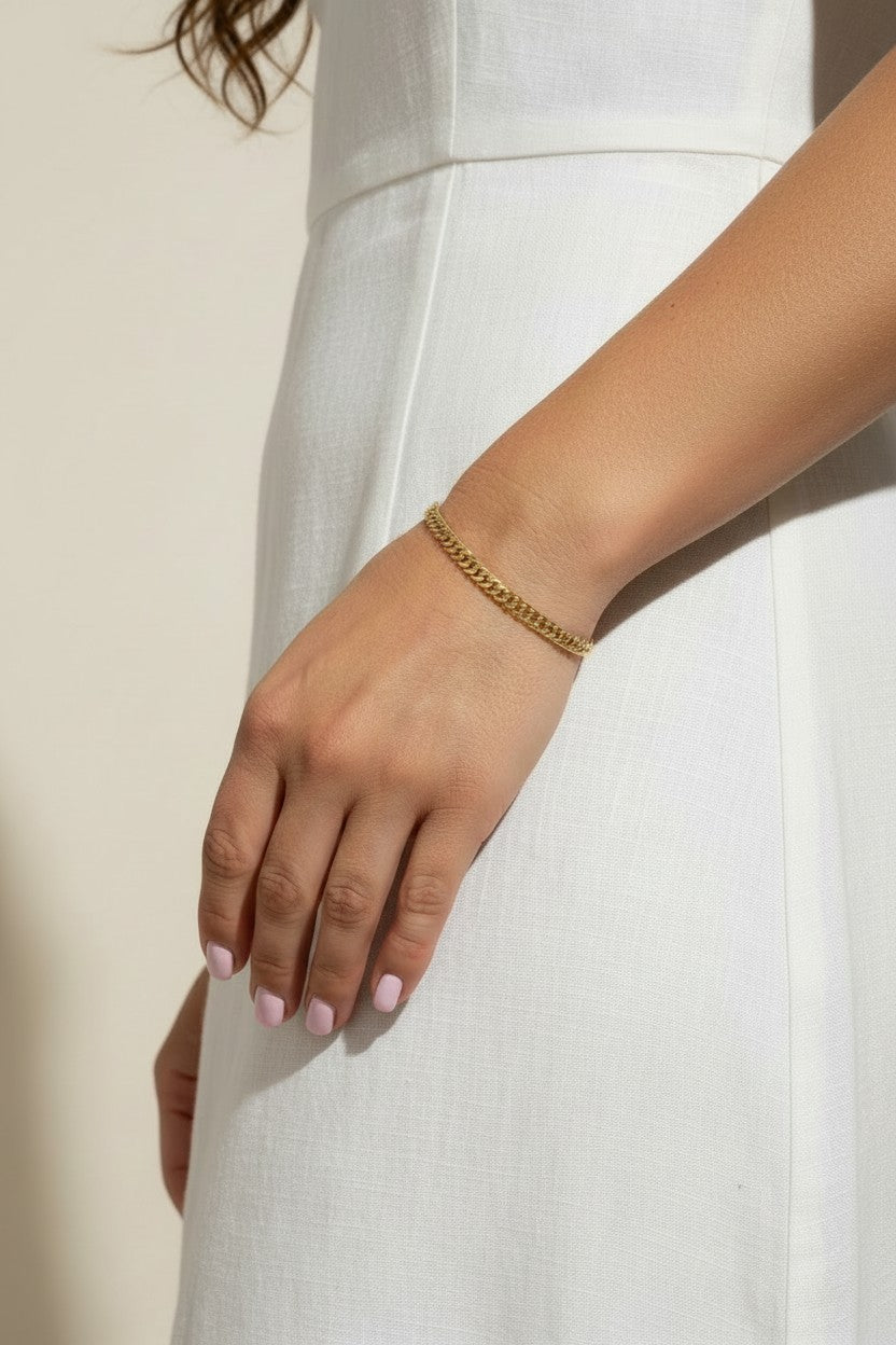 gold curb chain bracelet, curb link bracelet, chunky gold bracelet, everyday gold bracelet, flat link bracelet, statement chain bracelet, classic gold jewelry, on-model bracelet photography