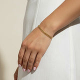 gold curb chain bracelet, curb link bracelet, chunky gold bracelet, everyday gold bracelet, flat link bracelet, statement chain bracelet, classic gold jewelry, on-model bracelet photography