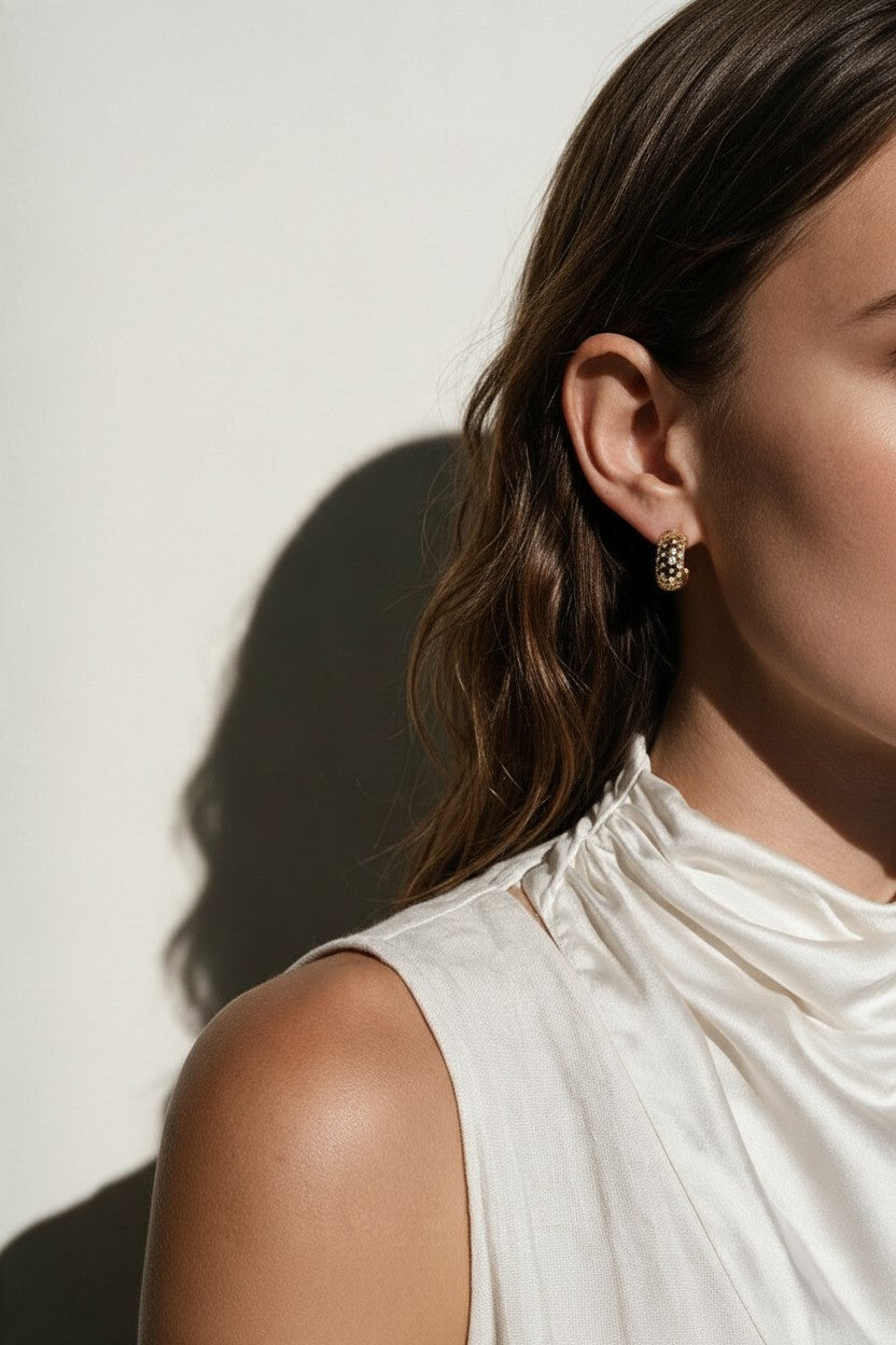 chunky gold hoop earrings on model, dome hoop earrings, crystal c hoop earrings, thick gold huggie earrings, sparkly gold hoops, statement huggie earrings, matching ring and earrings set, chunky gold dome ring, cubic zirconia hoop earrings, gold dome earrings, bold gold jewelry set, women’s chunky hoops